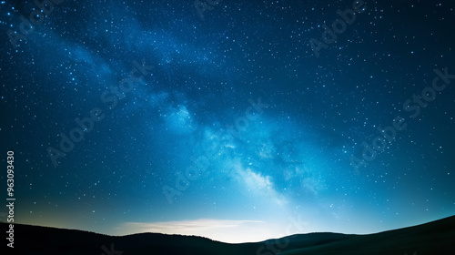 Celestial Tapestry: A breathtaking view of the Milky Way, painting the night sky with its ethereal glow, casting a celestial spell over the rolling hills below. 