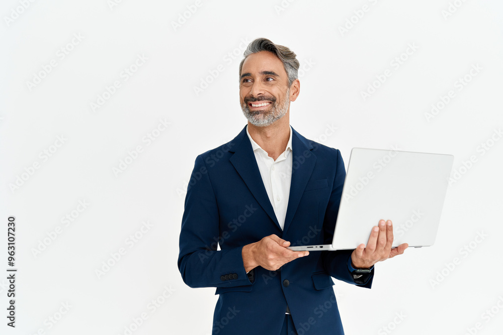 Happy mature business man using laptop standing isolated on white background. Middle aged professional businessman ceo executive wearing suit holding computer working online looking away at copy space Happy mature business man using laptop standing isolated on white background. Middle aged professional businessman ceo executive wearing suit holding computer working online looking away at copy space