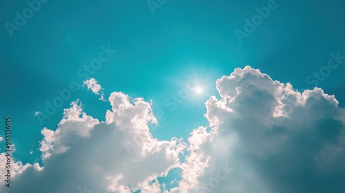 Sun Shining Through Fluffy Clouds photo