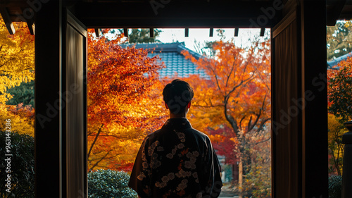 秋の寺院に立つ着物の若者の後ろ姿 photo