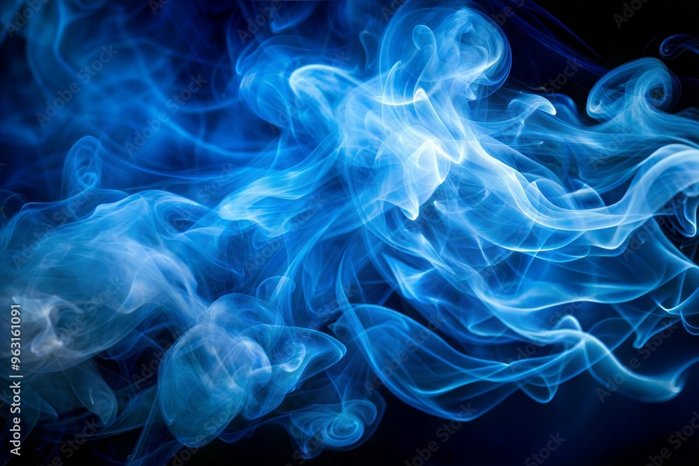 Abstract blue smoke swirls against dark background in soft light Abstract blue smoke swirls against dark background in soft light