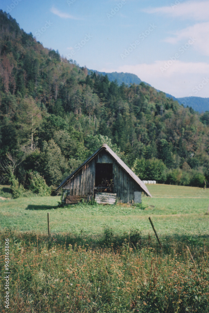 Abandoned Traditional Wooden Hut in Soča Valley during a Sunny Summer Day. Zatolmin, Tolmin, Slovenia. Film Photography Abandoned Traditional Wooden Hut in Soča Valley during a Sunny Summer Day. Zatolmin, Tolmin, Slovenia. Film Photography