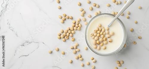 Wallpaper Mural Soy milk in a glass bowl with soy beans on a marble background. Close up, top view. Torontodigital.ca
