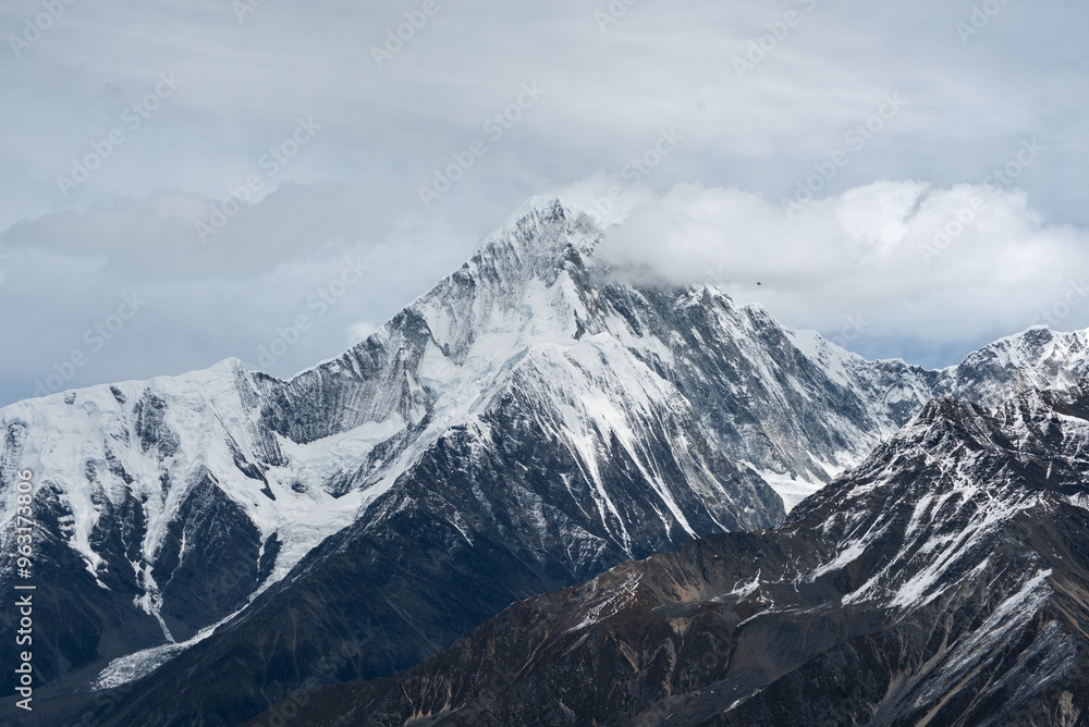 Minya Konka (Mount Gongga, Tibetan Snow Mountain) - in Sichuan Province, China. View from the west at Zimei Mountain Pass. Highest Mountain in Sichuan Province China. Minya Konka (Mount Gongga, Tibetan Snow Mountain) - in Sichuan Province, China. View from the west at Zimei Mountain Pass. Highest Mountain in Sichuan Province China.
