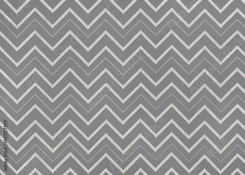 A seamless repeating pattern of thin, light gray zigzag lines on a dark gray background, with a slight blur effect to give it a sense of softness and subtlety.