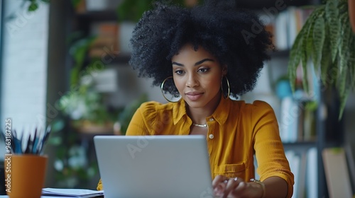 Portrait of joyful African American woman people with an afro hairstyle working on a laptop at a desk with documents : Generative AI