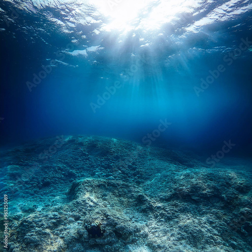 Underwater. Underwater Background Of The Ocean Bottom. Dark blue ocean surface seen from underwater. Underwater with fishes. Turquoise ocean water with sandy bottom underwater. Underwater world.