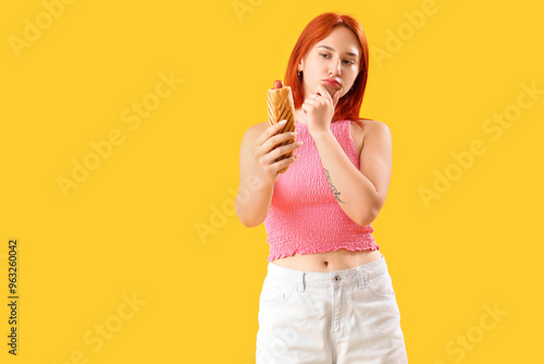 Thoughtful young woman with...