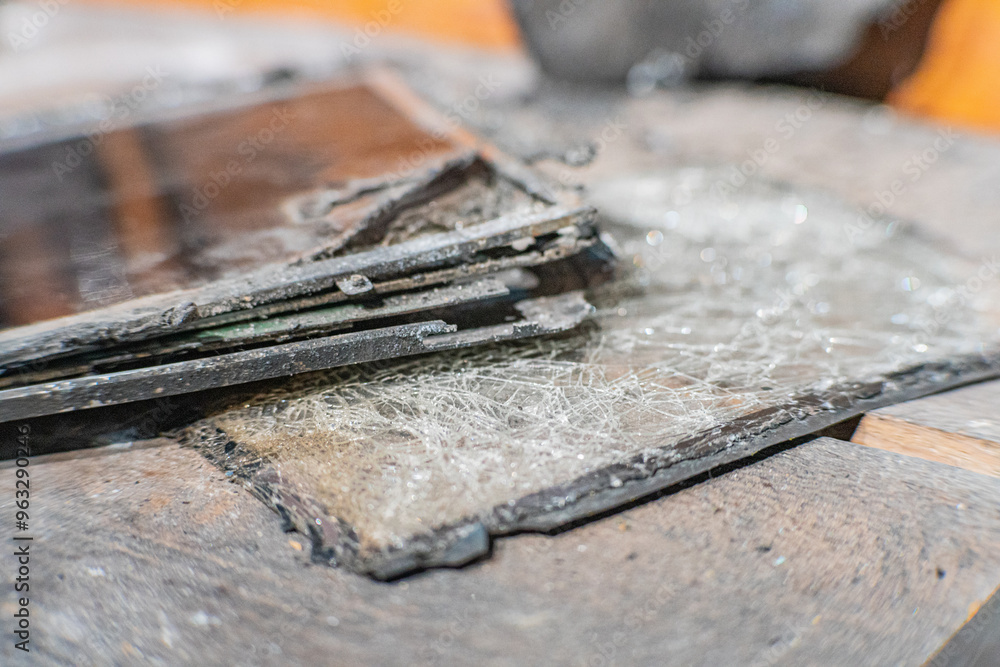 Tablet cracked screen damaged shattered and smashed broken not operating view from above insurance claim mobile phone with a broken display Tablet cracked screen damaged shattered and smashed broken not operating view from above insurance claim mobile phone with a broken display