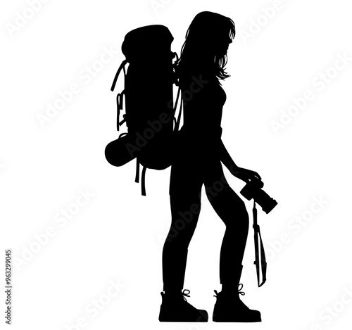 silhouette of a backpacker woman with camera 