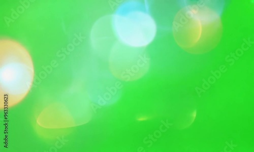 Lens flares on a green screen graphic resource for chroma keying overlay