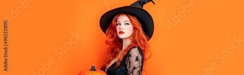 Stylish woman in a witch costume with orange hair and a hat, holding a pumpkin against an orange background, halloween concept, copy space for text