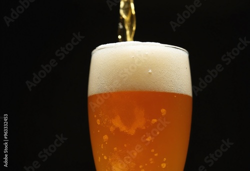 Wallpaper Mural Close up of Pouring Golden Craft Beer in Glass with Frothy Foam and Bubbles on Dark Background Torontodigital.ca