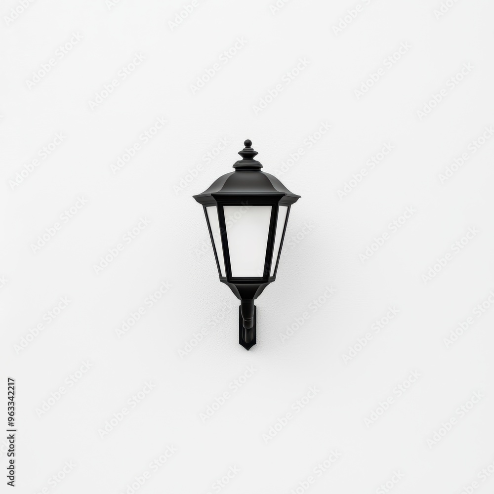 A black lamp is hanging on a white wall A black lamp is hanging on a white wall