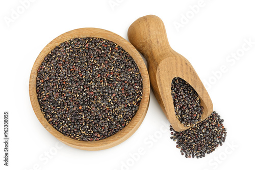 black quinoa in wooden bowl isolated on white background. Top view. Flat lay photo