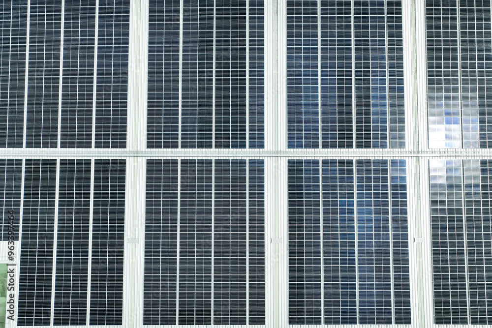 Solar energy for factory and warehouse building. Solar panels on roof of industrial plant. Commercial solar power. Rooftop solar power. Rooftop renewable energy system. Sustainable green energy. Solar energy for factory and warehouse building. Solar panels on roof of industrial plant. Commercial solar power. Rooftop solar power. Rooftop renewable energy system. Sustainable green energy.