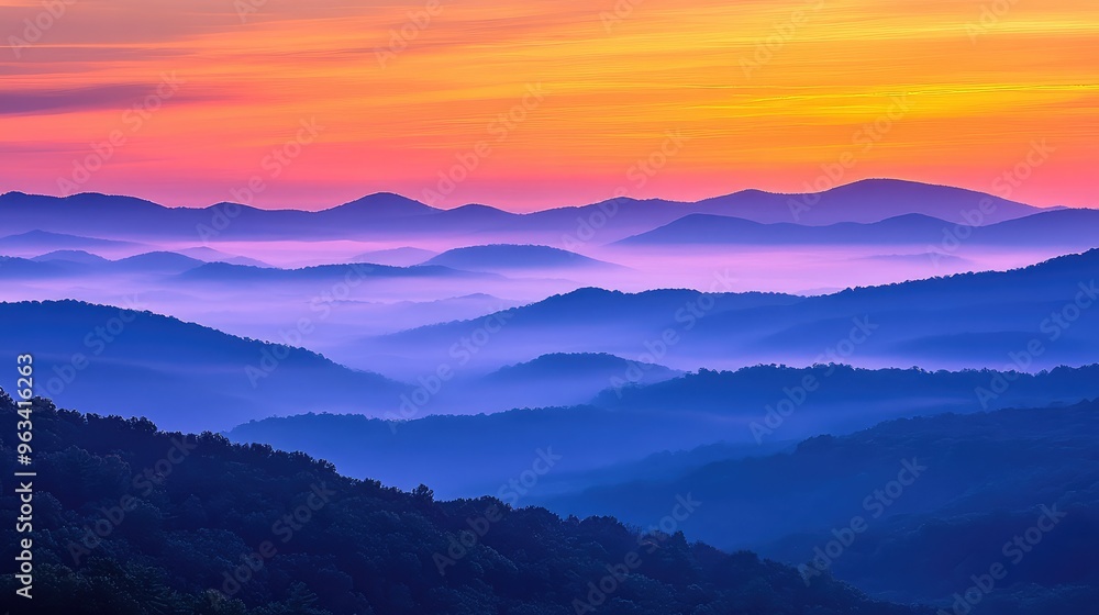 Sunset over the Blue Ridge Mountains, with layers of mist and warm hues filling the sky Sunset over the Blue Ridge Mountains, with layers of mist and warm hues filling the sky