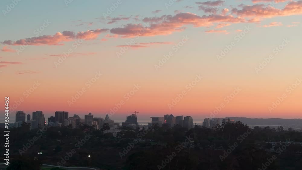 Aerial view of a beautiful North Park Sunset with mountain views and colorful sky with orange red pink and blue tones over the urban landscape Aerial view of a beautiful North Park Sunset with mountain views and colorful sky with orange red pink and blue tones over the urban landscape