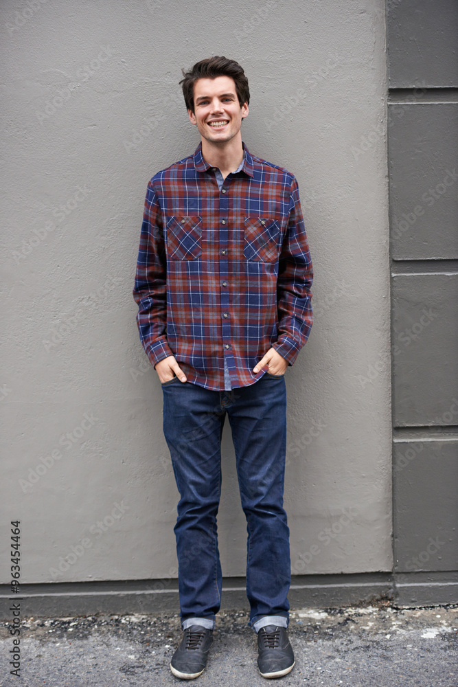 Portrait, happy and man in city on wall background outdoor for fashion, cool and trendy in Germany. Smile, confidence and person with hands in pockets, streetwear and urban style by building space Portrait, happy and man in city on wall background outdoor for fashion, cool and trendy in Germany. Smile, confidence and person with hands in pockets, streetwear and urban style by building space