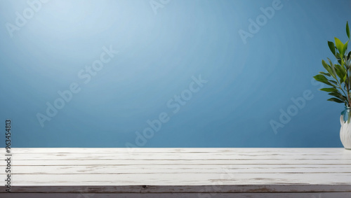 The empty white wooden table top with matte blue background. For product display