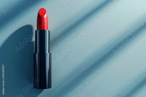 lipstick on a plain background with shadows. Copy space for text