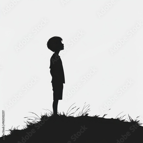 Silhouette of a child standing alone on a hill: serenity and solitude in nature