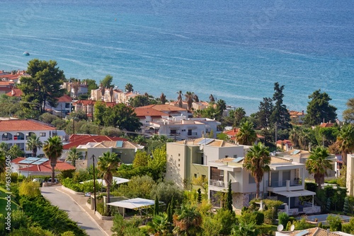 view of the region sea and greek houses from hill in pefkochori, greece