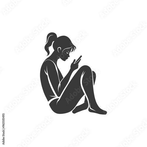 Silhouette of a woman sitting and looking at her phone