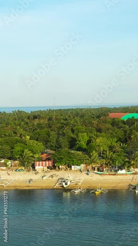 Drone view of coastline with fishing boats in Bantayan Island. Cebu, Philippines. Vertical view. photo