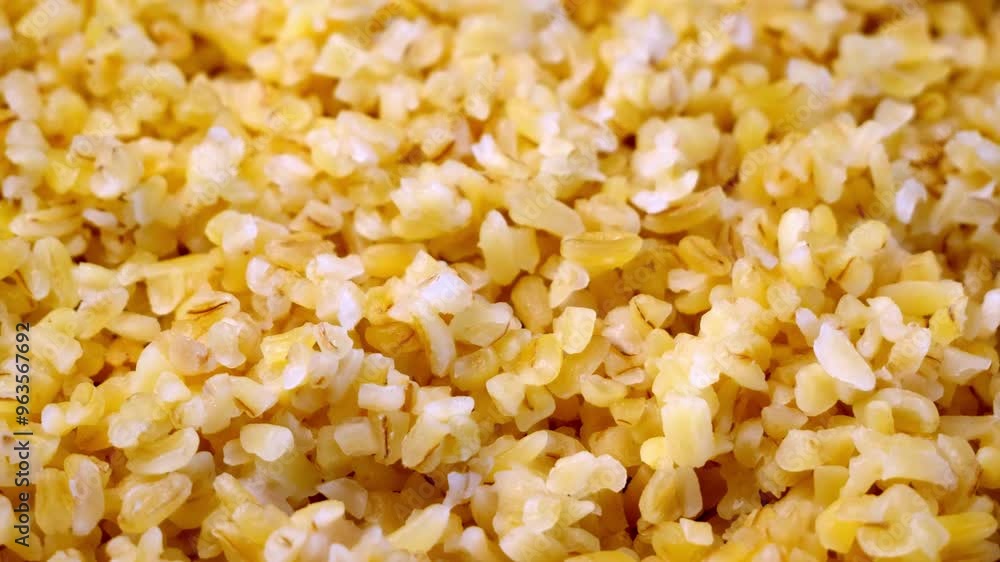 A macro view of bulgur wheat, highlighting its individual features and details. A macro view of bulgur wheat, highlighting its individual features and details.