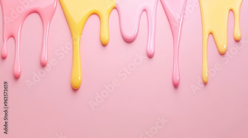 Vibrant drips of pink and yellow paint create a playful and artistic backdrop on a soft pink surface. photo