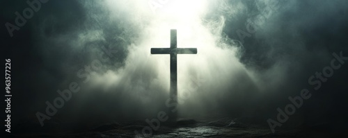 Cross in misty light, spiritual and serene