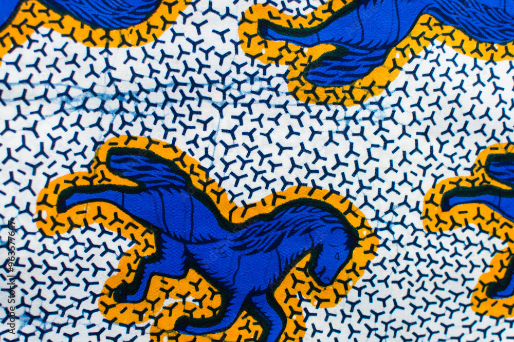 top view of blue and yellow ankara fabric, flatlay of nigerian wax cloth, rumpled blue and yellow ankara material top view of blue and yellow ankara fabric, flatlay of nigerian wax cloth, rumpled blue and yellow ankara material