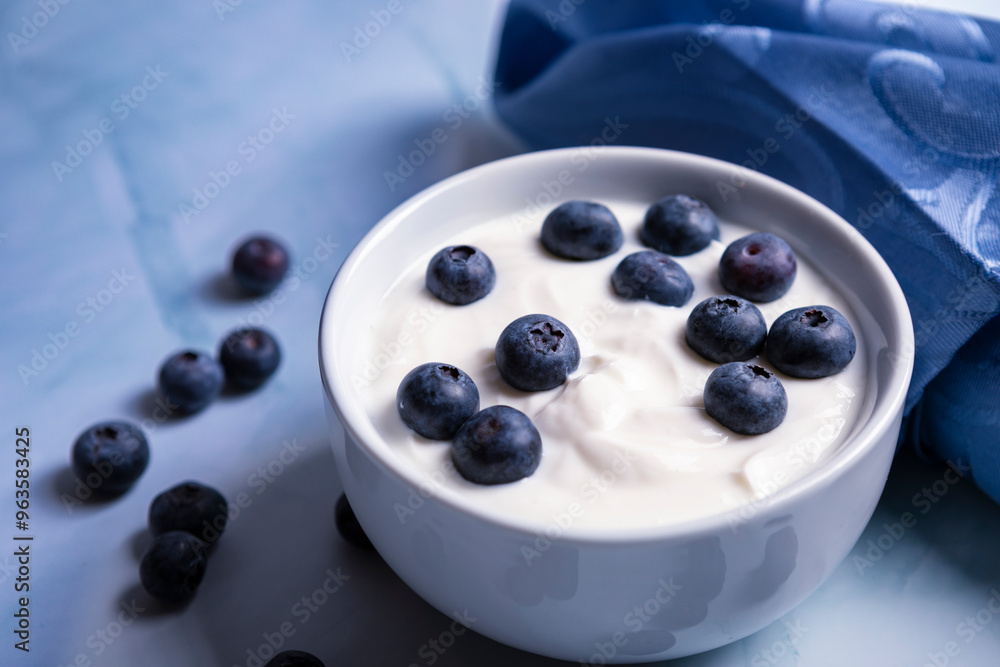 Creamy Greek yogurt and blueberries in a bowl Creamy Greek yogurt and blueberries in a bowl