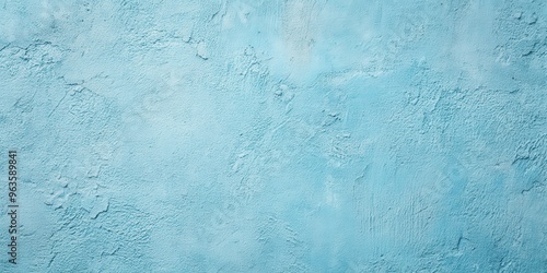 Light blue concrete wall background with a smooth texture perfect for adding a touch of modernity to any design project
