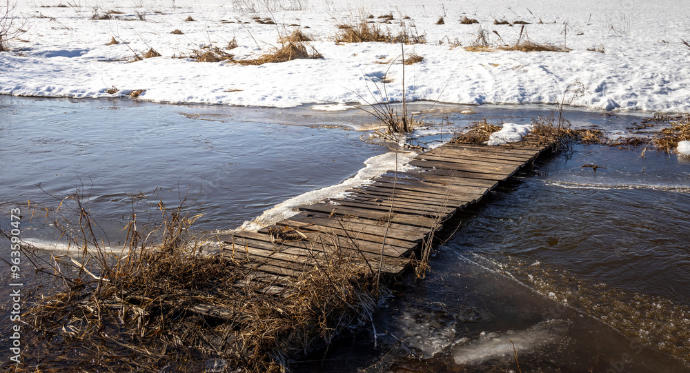 Fototapeta premium A bridge is covered in snow and ice
