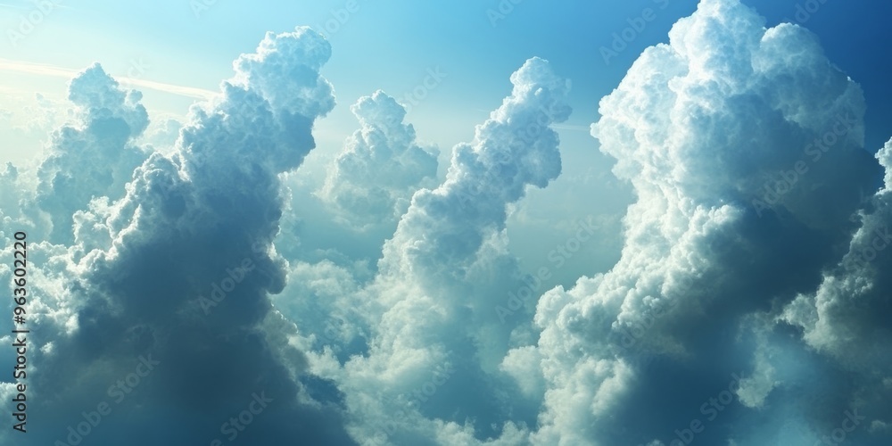 Fototapeta premium Soft, fluffy clouds rise against a bright blue sky, evoking deep peace and tranquility thats hard to ignore