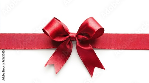 Elegant red ribbon tied in a perfect bow on a white background, ideal for gift wrapping during festive occasions