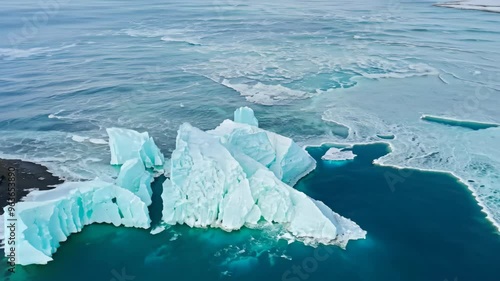 cebergs drifting on calm ocean waters photo