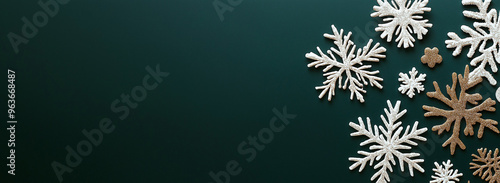 Wallpaper Mural Banner with snowflakes on dark green background, space for text. AI generation. Torontodigital.ca