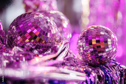 Group of shining disco balls on the floor in neon light. Party concept. photo