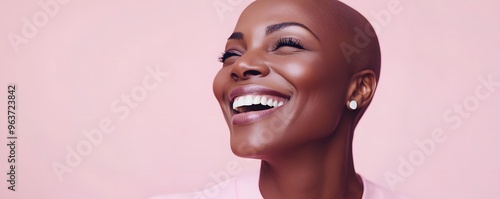 Close-up Portrait of a Bald Woman Smiling and Looking Up photo