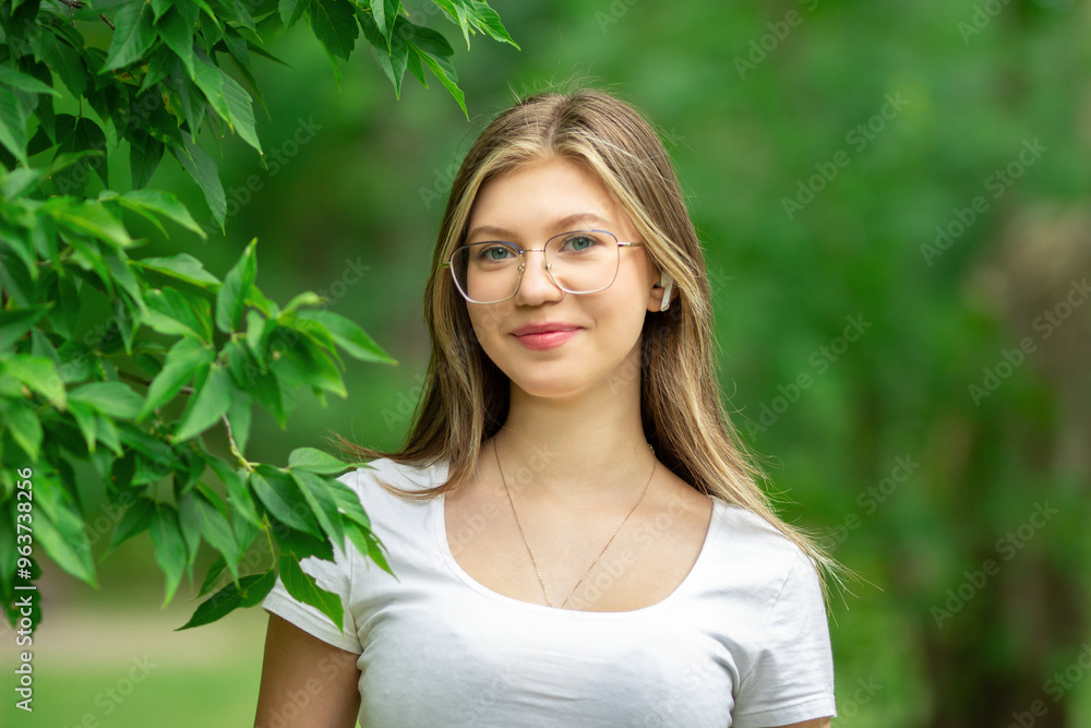 Simple country teenage girl wearing glasses near the tree. Simple country teenage girl wearing glasses near the tree.