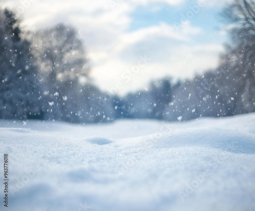 Wallpaper Mural Snowy landscape with soft snowdrifts and gentle falling snow, set against a blurred background of winter trees and a cloudy sky Torontodigital.ca