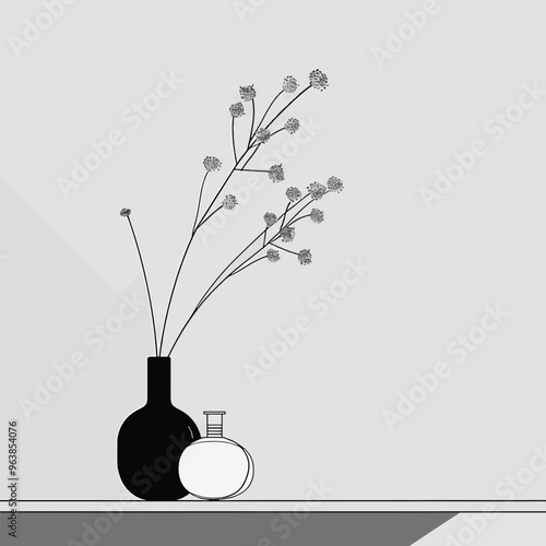 Simple black and white still life with a vase of flowers.