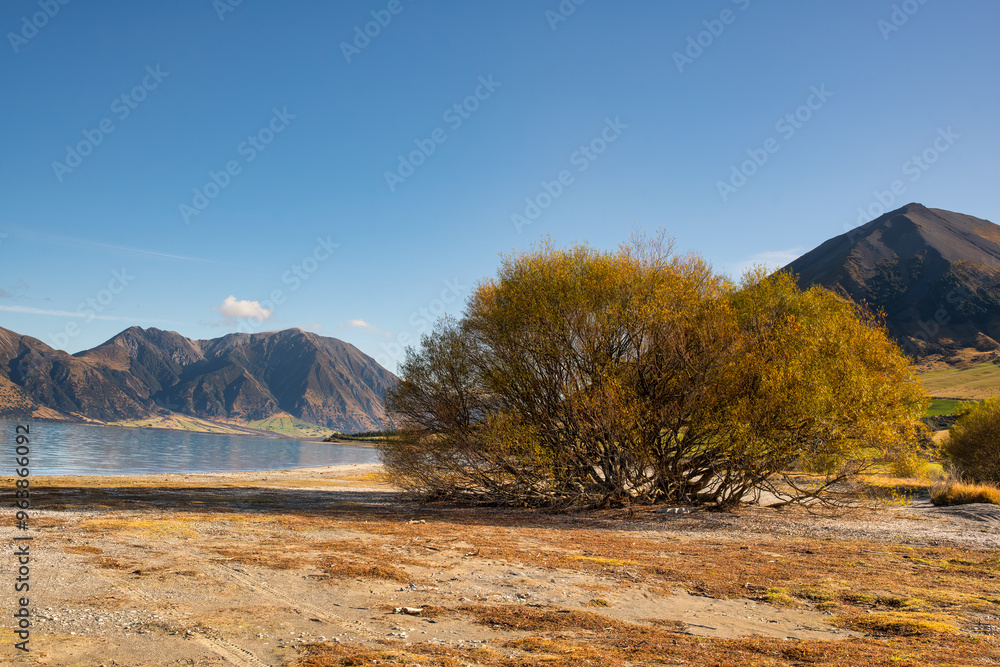 Fototapeta premium Remote alpine lake surrounded by mountain ranges