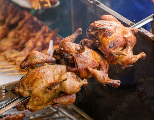 3 Brathähnchen auf dem Grillspiess, Brathähnchen von der Grillparty  photo