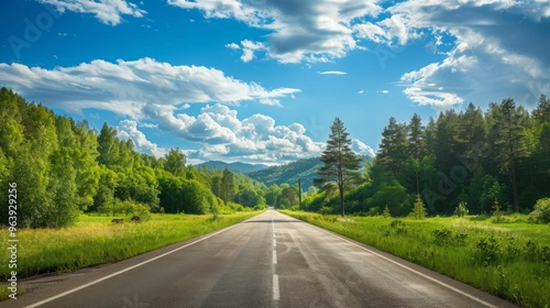 Country road and green forest natural landscape under the blue sky