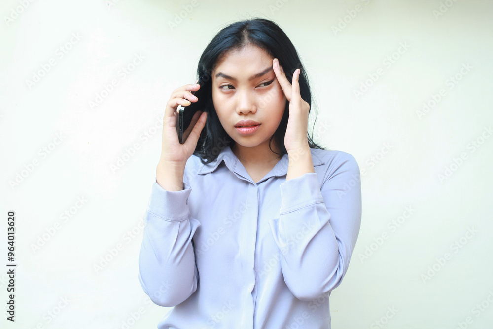 stressed asian young business woman have headache talking on cell phone, overworked female touching her had feeling dizzy isolated in white wear formal suit stressed asian young business woman have headache talking on cell phone, overworked female touching her had feeling dizzy isolated in white wear formal suit