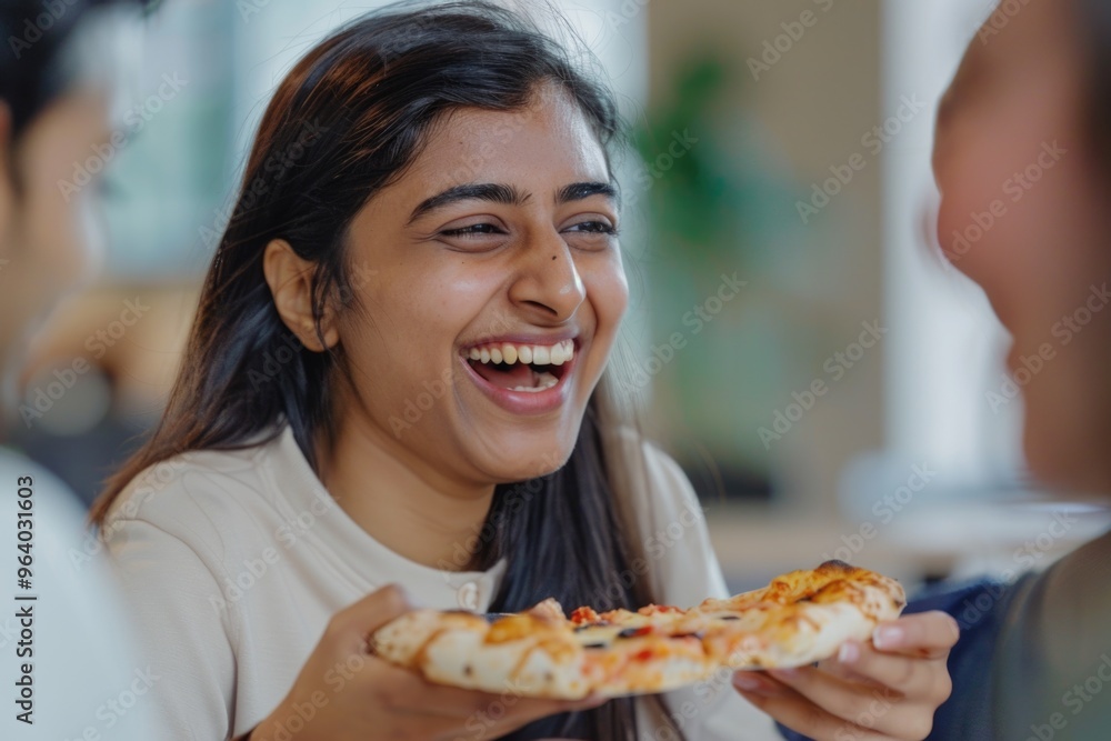 A woman is smiling and holding a slice of pizza. She is surrounded by other people, and they are all laughing and enjoying their time together. The atmosphere is lighthearted and fun A woman is smiling and holding a slice of pizza. She is surrounded by other people, and they are all laughing and enjoying their time together. The atmosphere is lighthearted and fun